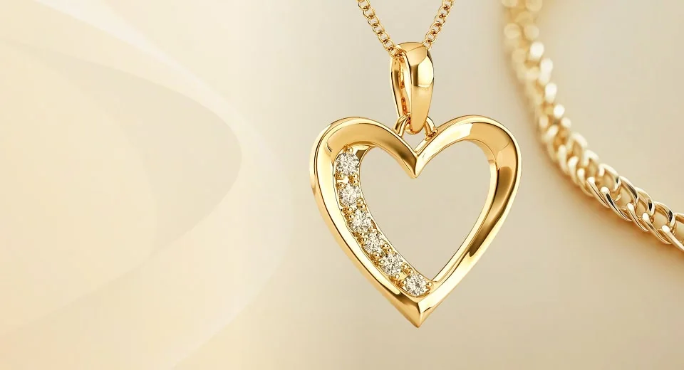 Gold heart pendant set with diamonds